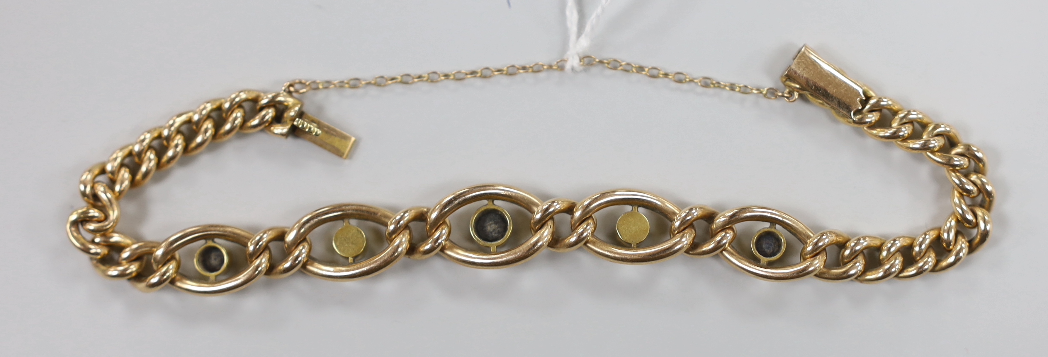 An Edwardian 15ct, sapphire and seed pearl set curb link bracelet, approx. 18cm